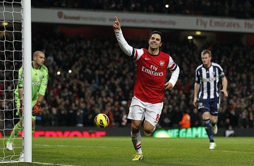 Arsenal's midfielder Mikel Arteta celebrates scoring his second penalty